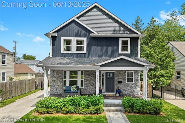 3278 Tyler Ave, Berkley, MI 48072 - view of front of home with covered porch, stone siding, and board and batten siding