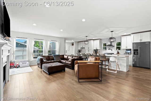 3278 Tyler Ave, Berkley, MI 48072 - living area with recessed lighting, wood finished floors, and a fireplace