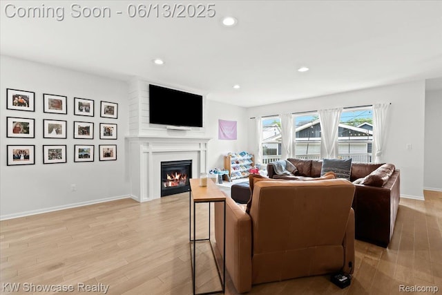 3278 Tyler Ave, Berkley, MI 48072 - living room with a glass covered fireplace, recessed lighting, and light wood finished floors