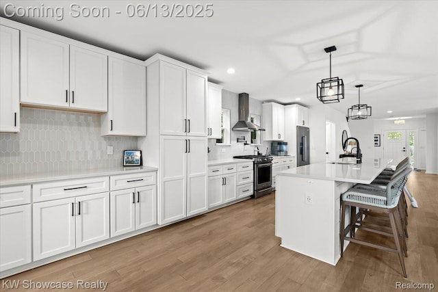 3278 Tyler Ave, Berkley, MI 48072 - kitchen with wall chimney exhaust hood, high quality appliances, white cabinetry, and recessed lighting