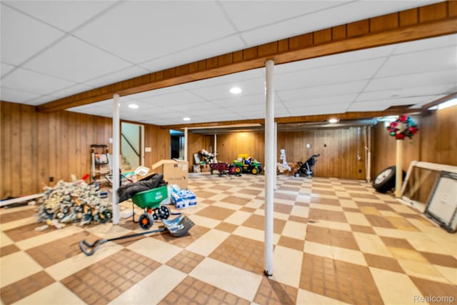 37288 Vernon Dr, Sterling Heights, MI 48310 - finished below grade area featuring a paneled ceiling, wood walls, tile patterned floors, recessed lighting, and stairs