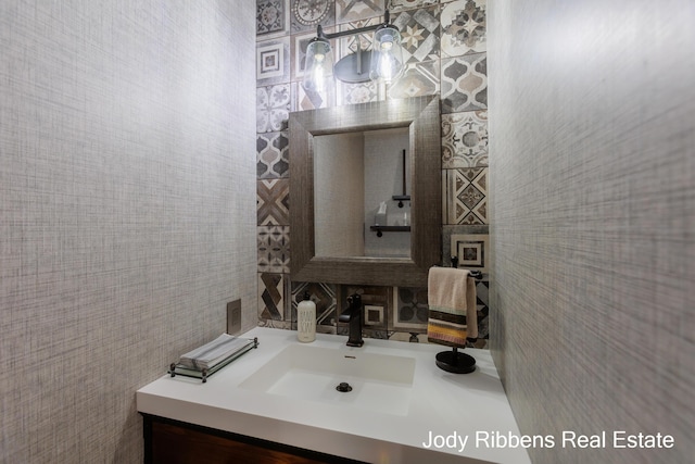 226 Sunset Ave NW, Grand Rapids, MI 49504 - bathroom featuring vanity, tile walls, and decorative backsplash