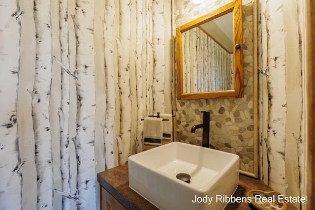 226 Sunset Ave NW, Grand Rapids, MI 49504 - bathroom with vanity and wallpapered walls