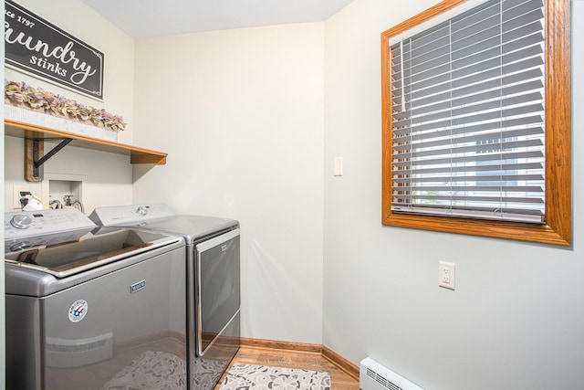 226 Sunset Ave NW, Grand Rapids, MI 49504 - laundry area with independent washer and dryer, wood finished floors, and baseboards