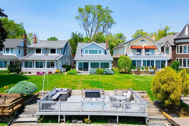 29899 E River Rd, Grosse Ile, MI 48138 - back of property featuring a deck, an outdoor hangout area, a residential view, and a yard