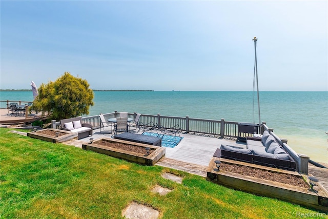 29899 E River Rd, Grosse Ile, MI 48138 - view of patio / terrace with a vegetable garden and a deck with water view