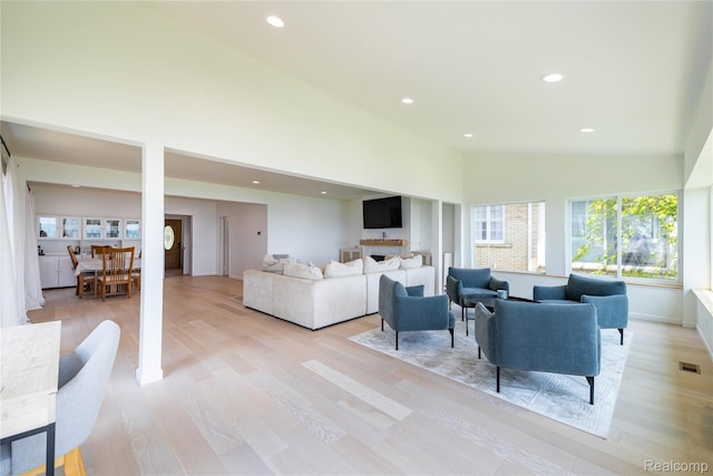 29899 E River Rd, Grosse Ile, MI 48138 - living room with light wood finished floors, recessed lighting, and high vaulted ceiling