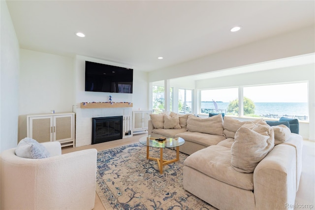29899 E River Rd, Grosse Ile, MI 48138 - living area with recessed lighting, a glass covered fireplace, and wood finished floors
