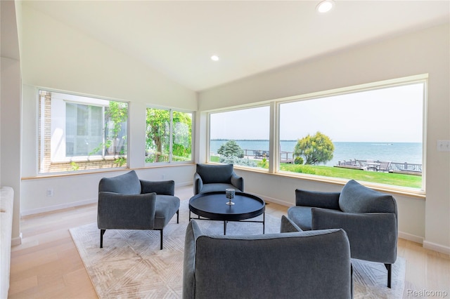 29899 E River Rd, Grosse Ile, MI 48138 - sitting room featuring light wood-style floors, recessed lighting, baseboards, a water view, and lofted ceiling