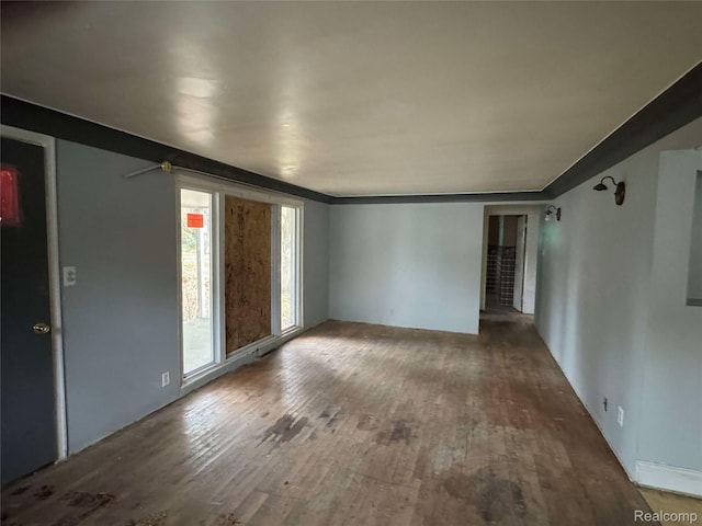 7025 Coldwater Rd, Flushing, MI 48433 - spare room featuring wood finished floors