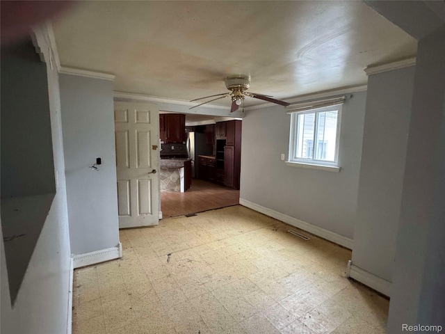 7025 Coldwater Rd, Flushing, MI 48433 - unfurnished living room featuring a ceiling fan, light flooring, ornamental molding, and baseboards