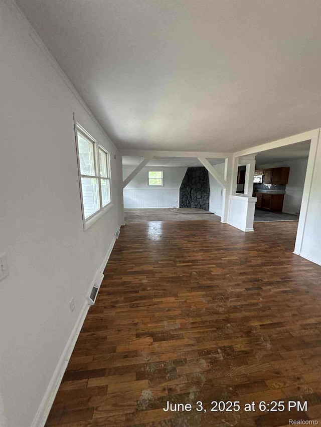 7025 Coldwater Rd, Flushing, MI 48433 - unfurnished living room with dark wood finished floors and baseboards