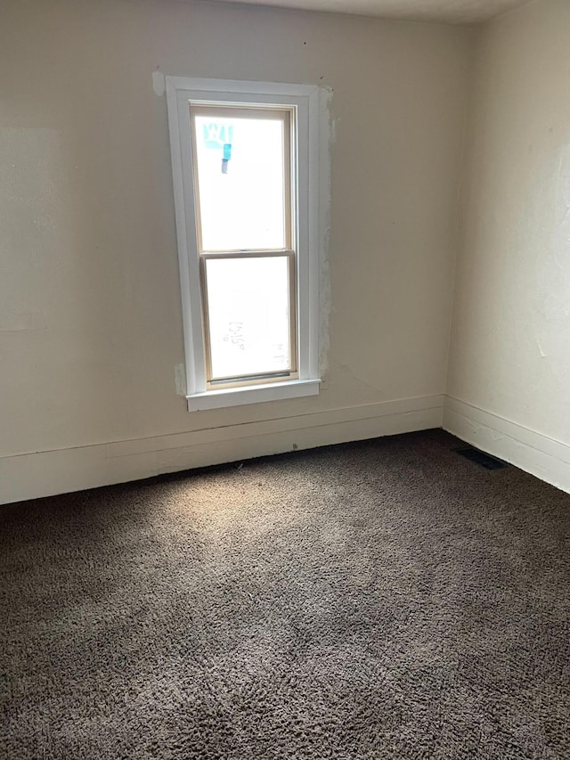 1122 Prospect St, Lansing, MI 48912 - unfurnished room with carpet flooring and baseboards