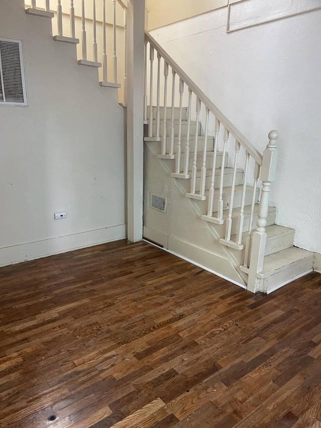 1122 Prospect St, Lansing, MI 48912 - staircase featuring wood finished floors and baseboards