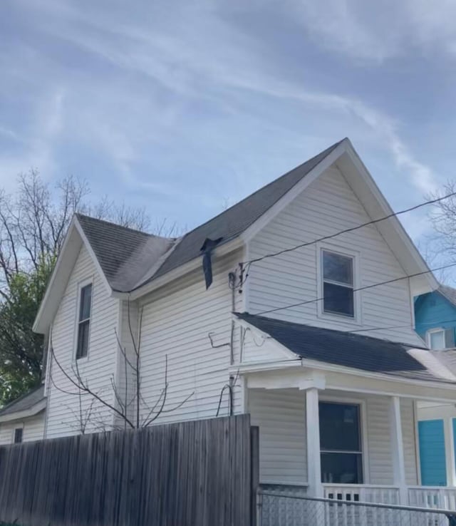 1122 Prospect St, Lansing, MI 48912 - view of property exterior featuring covered porch and a shingled roof