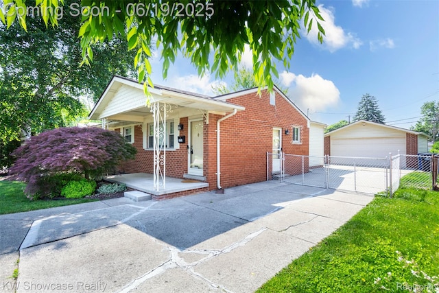 30731 Middlebury St, Westland, MI 48186 - view of front of house featuring brick siding, a detached garage, a gate, covered porch, and an outbuilding
