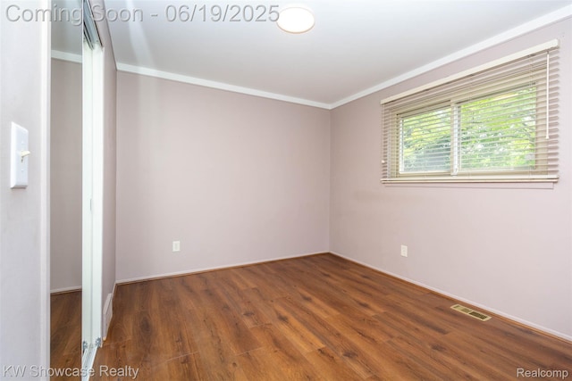 30731 Middlebury St, Westland, MI 48186 - spare room featuring wood finished floors and crown molding