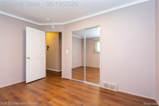 30731 Middlebury St, Westland, MI 48186 - unfurnished bedroom featuring wood finished floors, ornamental molding, and a closet