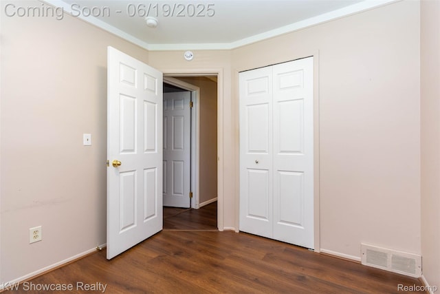 30731 Middlebury St, Westland, MI 48186 - unfurnished bedroom featuring dark wood-style flooring and a closet