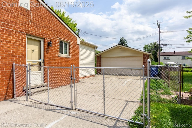 30731 Middlebury St, Westland, MI 48186 - view of home's exterior with a gate, a detached garage, brick siding, and an outdoor structure