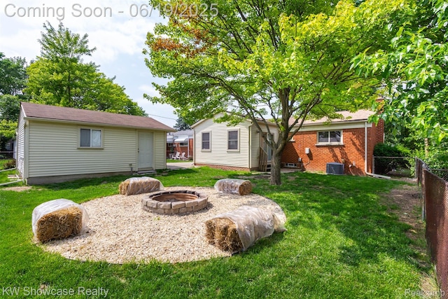 30731 Middlebury St, Westland, MI 48186 - view of yard with an outdoor fire pit and an outdoor structure