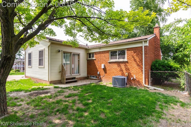 30731 Middlebury St, Westland, MI 48186 - rear view of property with a chimney
