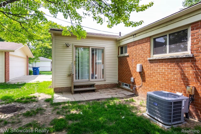 30731 Middlebury St, Westland, MI 48186 - back of house with a garage and a patio