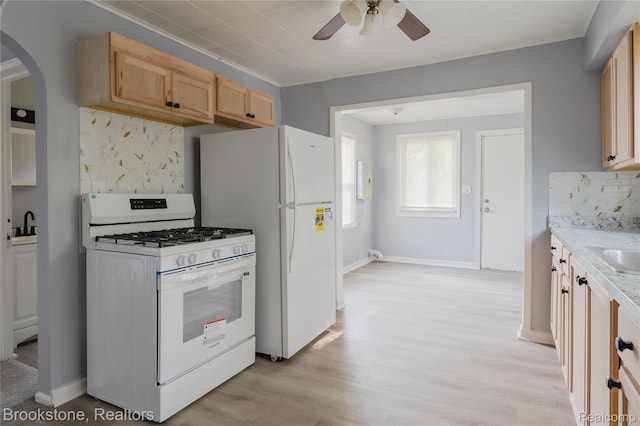 23123 Lambrecht Ave, Eastpointe, MI 48021 - kitchen with white appliances, ceiling fan, tasteful backsplash, arched walkways, and light brown cabinetry