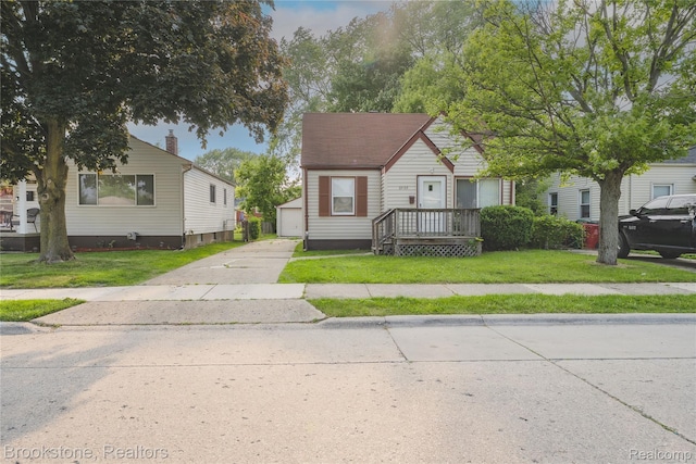 23123 Lambrecht Ave, Eastpointe, MI 48021 - bungalow-style house with an outbuilding, a front yard, and a garage