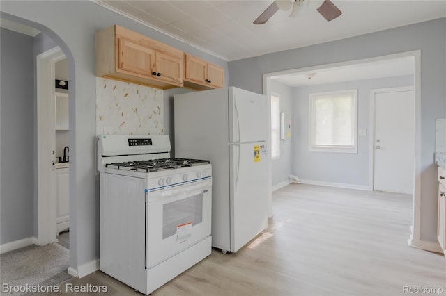 23123 Lambrecht Ave, Eastpointe, MI 48021 - kitchen featuring white appliances, arched walkways, ceiling fan, light brown cabinetry, and baseboards