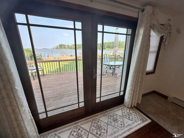 3117 Morin Point St, Erie, MI 48133 - doorway with a water view, baseboard heating, baseboards, and wood finished floors