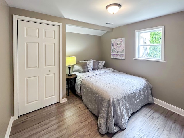 1492 Webber Ave, Burton, MI 48529 - bedroom featuring baseboards and wood finished floors