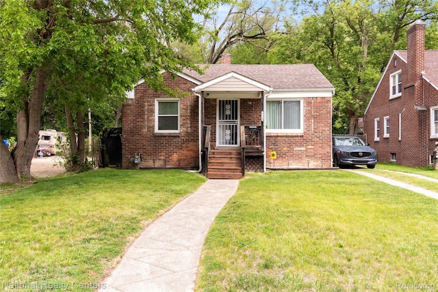 17710 Trinity St, Detroit, MI 48219 - bungalow featuring brick siding, a front yard, a chimney, and a shingled roof