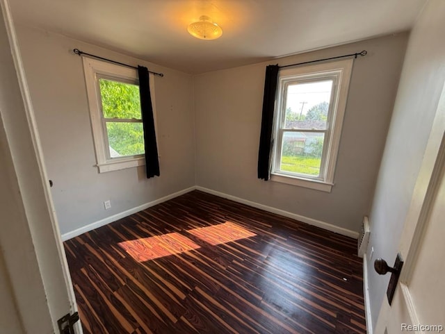 1408 Lincoln Dr, Flint, MI 48503 - unfurnished room featuring dark wood-style floors and baseboards