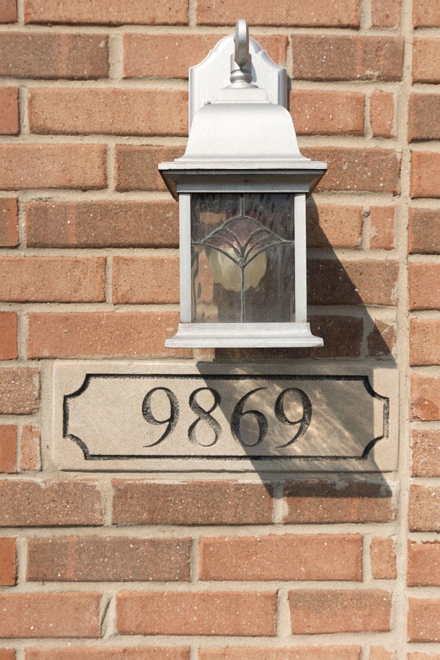 9869 Dartmoor Cir, Van Buren, MI 48111 - exterior view of brick siding