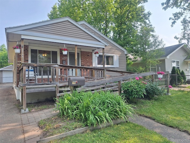 220 W Yale Ave, Pontiac, MI 48340 - view of front of house featuring covered porch and brick siding
