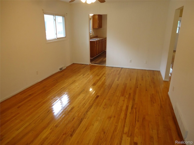 220 W Yale Ave, Pontiac, MI 48340 - unfurnished room with a sink, ceiling fan, light wood-style flooring, and baseboards