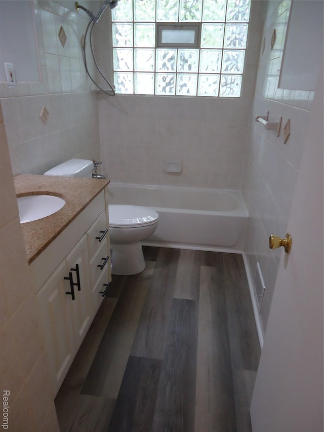 220 W Yale Ave, Pontiac, MI 48340 - full bath featuring tile walls, vanity,  shower combination, toilet, and wood finished floors
