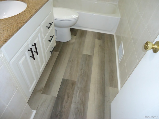 220 W Yale Ave, Pontiac, MI 48340 - bathroom featuring vanity, wood finished floors, and toilet