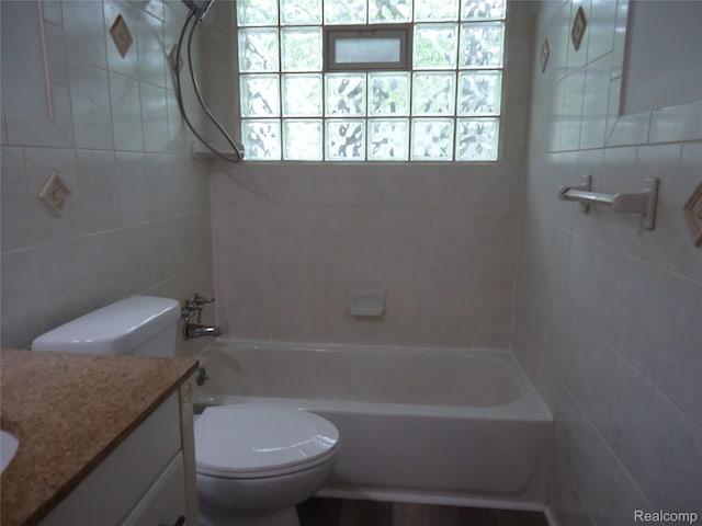 220 W Yale Ave, Pontiac, MI 48340 - bathroom with vanity, toilet, tile walls, and shower / washtub combination