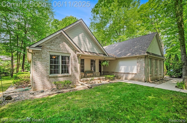 3675 S Commerce Rd, Commerce Twp, MI 48390 - view of front facade with brick siding, a front lawn, and a shingled roof