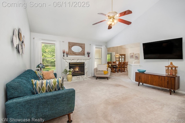 3675 S Commerce Rd, Commerce Twp, MI 48390 - living area with high vaulted ceiling, carpet, a ceiling fan, and a premium fireplace