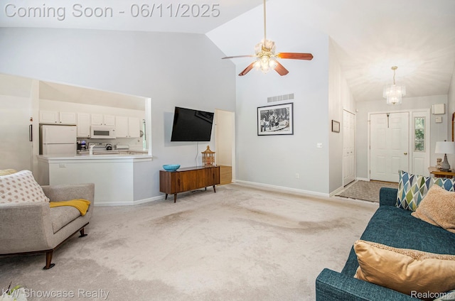 3675 S Commerce Rd, Commerce Twp, MI 48390 - living area featuring high vaulted ceiling, light carpet, baseboards, ceiling fan, and a chandelier