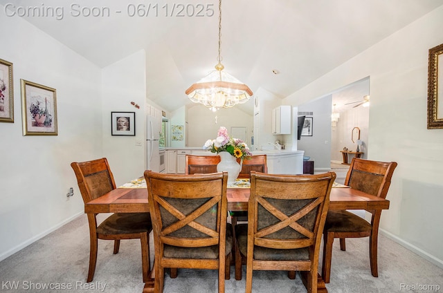 3675 S Commerce Rd, Commerce Twp, MI 48390 - dining room with a chandelier, light colored carpet, baseboards, and vaulted ceiling