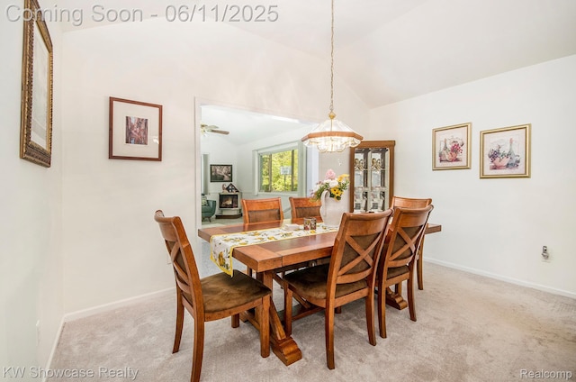 3675 S Commerce Rd, Commerce Twp, MI 48390 - dining space featuring a chandelier, vaulted ceiling, light carpet, and baseboards