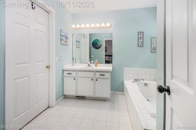 3675 S Commerce Rd, Commerce Twp, MI 48390 - full bathroom featuring vanity, a garden tub, tile patterned flooring, and baseboards