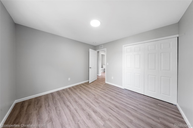 22114 Pleasant Ave, Eastpointe, MI 48021 - unfurnished bedroom featuring wood finished floors, baseboards, and a closet