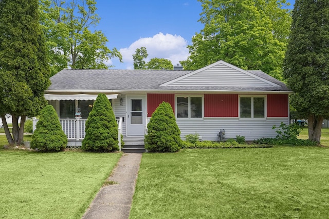 817 Cherry Ave, Big Rapids, MI 49307 - view of front of house with roof with shingles and a front lawn