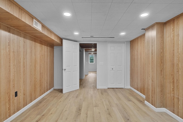 817 Cherry Ave, Big Rapids, MI 49307 - basement featuring light wood finished floors, baseboards, wooden walls, and recessed lighting