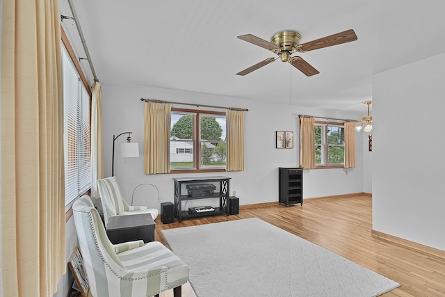 817 Cherry Ave, Big Rapids, MI 49307 - living room featuring ceiling fan, wood finished floors, and baseboards